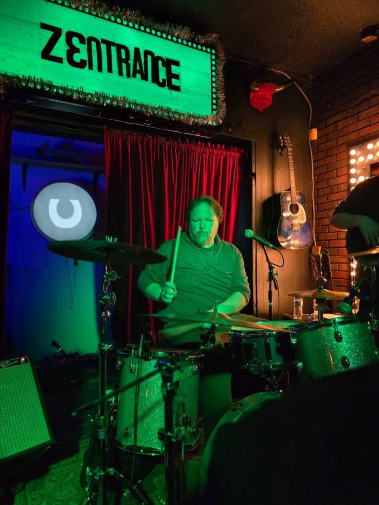 Chris Beard playing drums with Zentrance