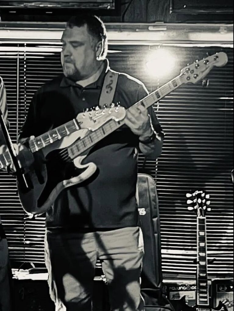 Chris Ogle playing bass with Zentrance (black and white)